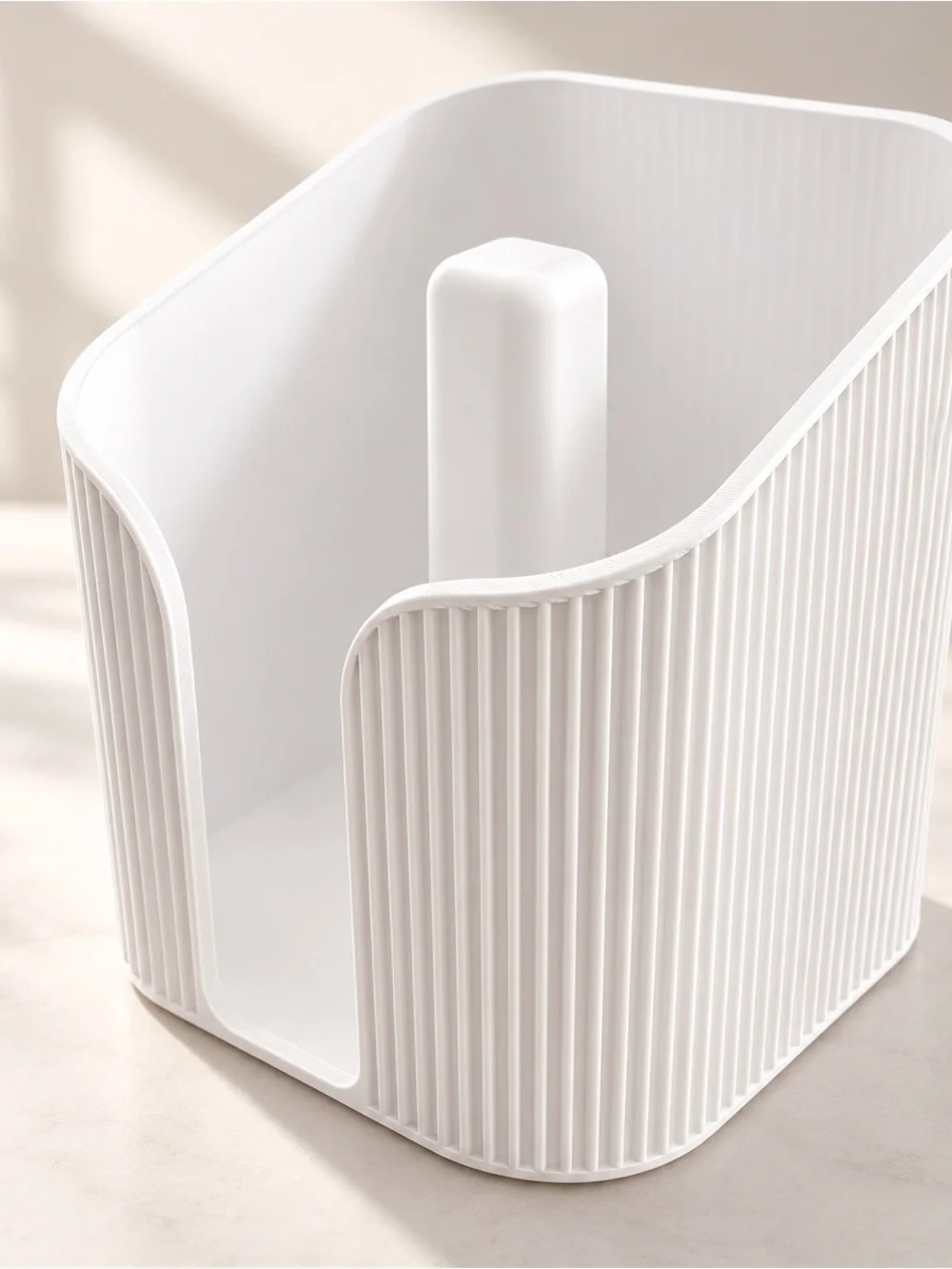 White Ribbed Plastic Toilet Paper Organizer with Central Spindle